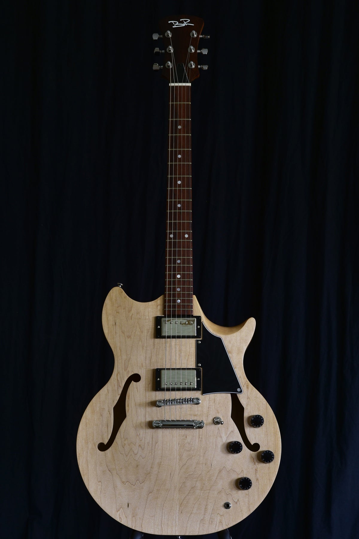Front view of the Lineage 6 solid-wood semi-hollow electric guitar