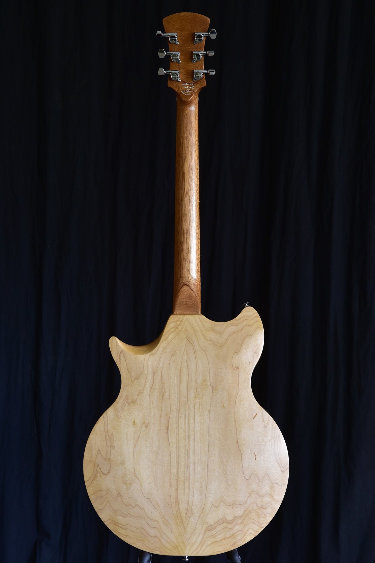 Back view of the Lineage 6 solid-wood semi-hollow electric guitar