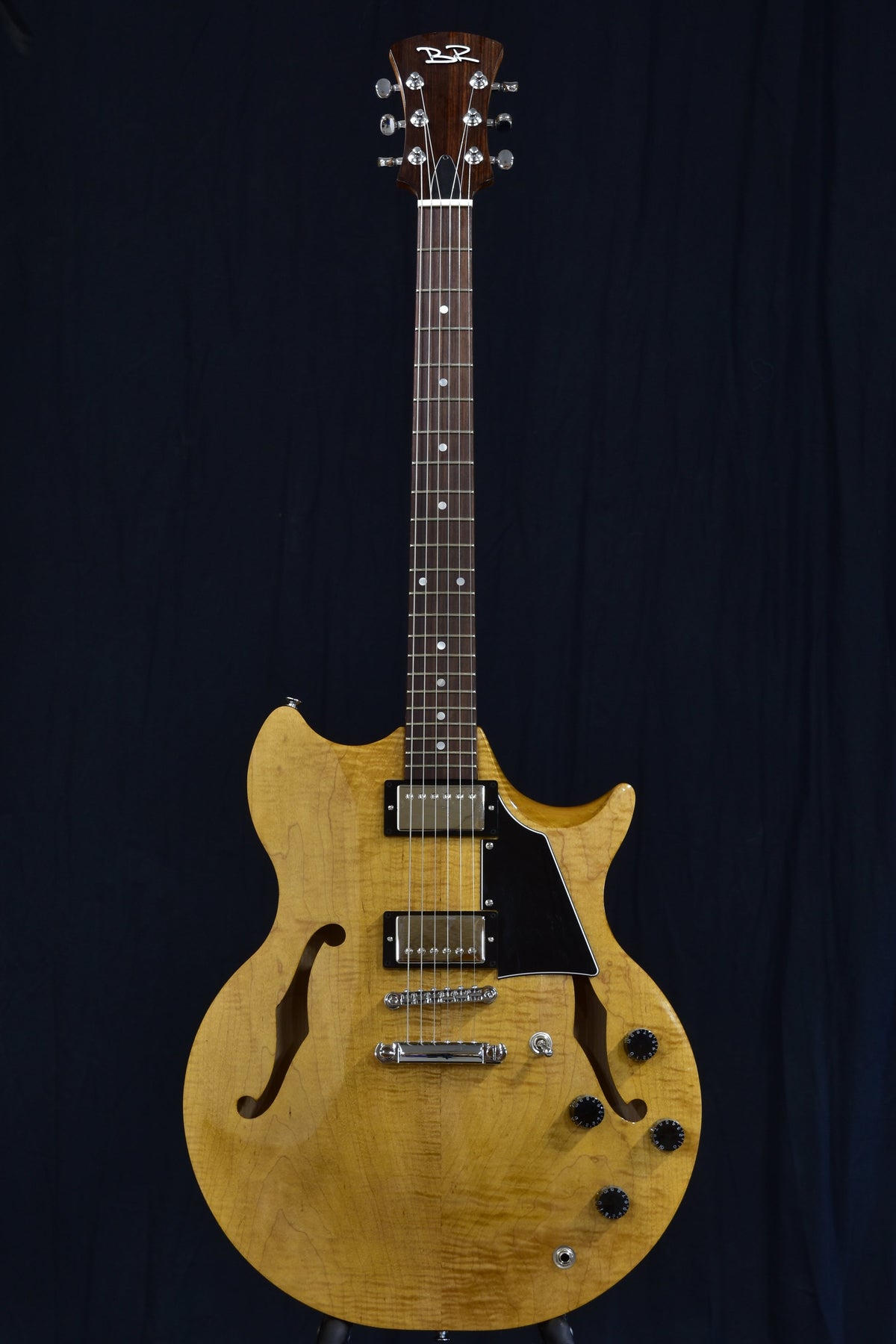 Front view of the Lineage 6 solid-wood semi-hollow electric guitar